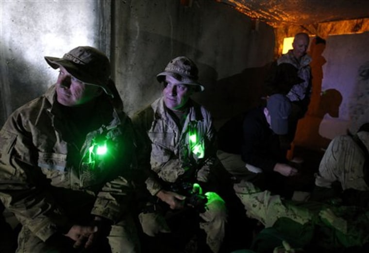 Canadian soldiers shelter in a bunker following rocket attacks at Kandahar Airfield in southern Afghanistan on Friday.